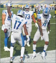  ?? MATT LUDTKE — THE ASSOCIATED PRESS ?? Detroit Lions’ Marvin Hall, second from left, celebrates his touchdown catch during Sunday’s 42-21 road loss to the Green Bay Packers. Detroit fell to 0-2 this season.