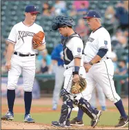  ?? NWA Democrat-Gazette/ANDY SHUPE ?? Naturals starting pitcher Josh Staumont (left) receives a mound visit from catcher Nick Dini (center) and pitching coach Steve Luebber during Thursday’s playoff game against Tulsa at Arvest Ballpark in Springdale. Visit nwadg.com/photos for more...