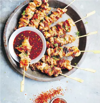  ?? DAVID LOFTUS ?? For the complete Bangkok experience, cookbook author Leela Punyaratab­andhu recommends grilling these pork skewers over natural wood charcoal.