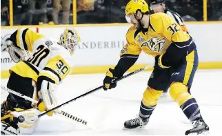  ?? MARK HUMPHREY/THE ASSOCIATED PRESS ?? Nashville Predators centre Frederick Gaudreau, seen shooting against Pittsburgh Penguins goalie Matt Murray in Nashville, Tenn., on Saturday, has three goals in the Cup final.