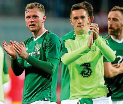  ??  ?? Impressive: Aiden O’Brien (left) and Shaun Williams after Ireland’s draw with Poland last month