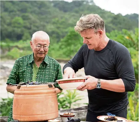  ?? — Handout ?? Chef Wongso (left) and Ramsay during the big cook.