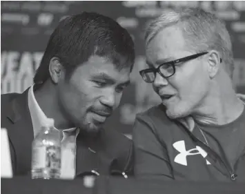  ?? ASSOCIATED PRESS ?? Manny Pacquiao and Freddie Roach.