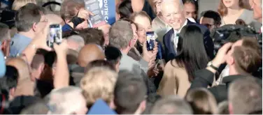  ??  ?? ↑
Joe Biden celebrates with his supporters after victory at a rally in South Carolina, Columbia, on Saturday.
Agence France-presse