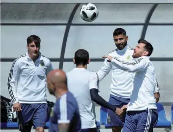  ?? — Reuters ?? Lionel Messi and his team-mates attend a training session.