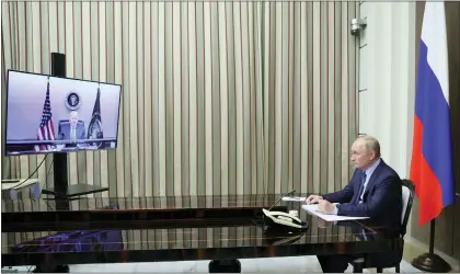  ?? MIKHAIL METZEL — VIA THE ASSOCIATED PRESS ?? Russian President Vladimir Putin talks with President Joe Biden via videoconfe­rence in the Bocharov Ruchei residence in the Black Sea resort of Sochi, Russia, on Tuesday. The two leaders discussed tensions over Ukraine.