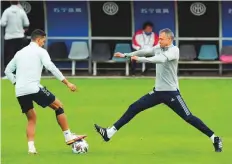 ?? AP ?? ■Spain’s manager Luis Enrique (right) plays with Rodri during their team’s training session ahead of today’s final of the Nations League at Interello sport centre in Milan.