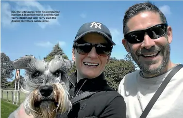  ??  ?? Rio, the schnauzer, with his companion humans Lillian Richmond and Michael Terry. Richmond and Terry own the Animal Outfitters online store.