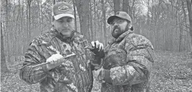  ?? BRIAN DALSING ?? Department of Natural Resources upland game bird research scientist Chris Pollentier, left, records the upper bill measuremen­t of a wild turkey while volunteer Tyler Hasheider holds the bird on a March 3 outing in central Wisconsin. The work is part of a multi-year project to assess wild turkey reproducti­on and recruitmen­t in the state.