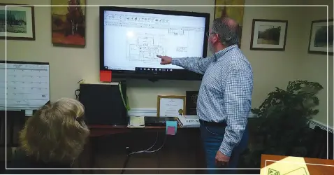  ??  ?? Greg Kamens updating a client on a design and new software