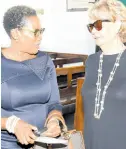  ?? ?? Executive director of the Private Sector Organisati­on of Jamaica Sacha Vaccianna-Riley (left) exchanges greetings with consultant Patricia Francis during the Shipping Associatio­n of Jamaica’s anniversar­y service of thanksgivi­ng.