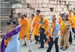  ?? — PTI ?? A group of 150 NRIs from 22 countries, affiliated to the Vishva Hindu Parishad, visit Ayodhya to offer prayers at the makeshift Ram temple on Thursday.