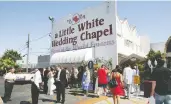  ?? ETHAN MILLER / GETTY IMAGES ?? More than half a million 10-minute ceremonies have taken place at the storied Las Vegas venue.