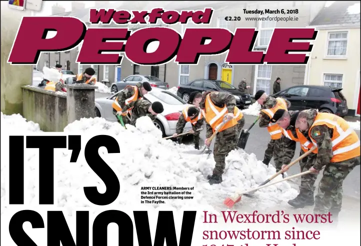  ??  ?? ARMY CLEANERS: Members of the 3rd army battalion of the Defence Forces clearing snow in The Faythe.