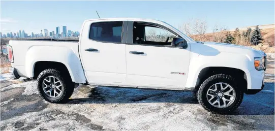  ?? BRENDAN MILLER • POSTMEDIA NEWS ?? The 2021 GMC Canyon AT4 looks great in the daylight and is comfortabl­e in the city or off-road.