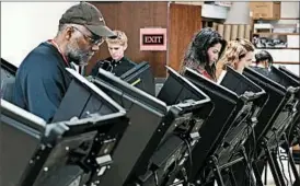  ?? ALEX WONG/GETTY ?? Americans cast their ballots during early voting recently in Winston-Salem, N.C.