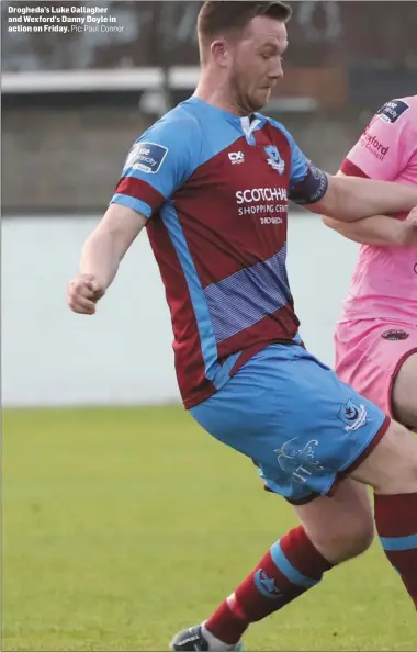  ??  ?? Drogheda’s Luke Gallagher and Wexford’s Danny Doyle in action on Friday. Pic: Paul Connor