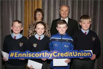  ??  ?? Oylegate NS who finished second in the Under 13 section. Front: Lorcan Kinsella, Ella Hayden, Sean Downes and Niall Byrne. Back: Martina Gately (teacher) and Nicky Cosgrave (chairman ECU).