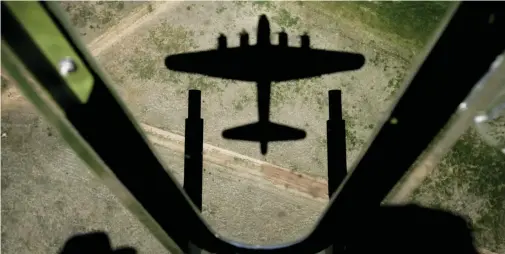  ?? (Photo courtesy of the Collings Foundation) ?? A rider’s view from the bombardier position in a B-17.