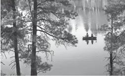  ?? DAVID WALLACE/THE REPUBLIC ?? People fish at Fool Hollow Lake Recreation Area in Show Low.