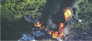  ?? WLBT-TV VIA AP ?? Smoke and flames rise from a military plane Monday that crashed in a farm field in Itta Bena, Miss., killing all 16 people on board.