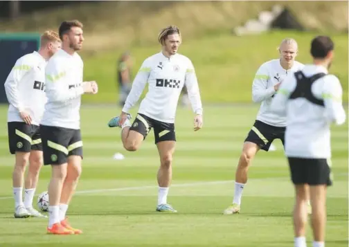  ?? Age r ?? ±
Manchester City’s players attend a training session ahead of their Champions League match against Borussia Dortmund.