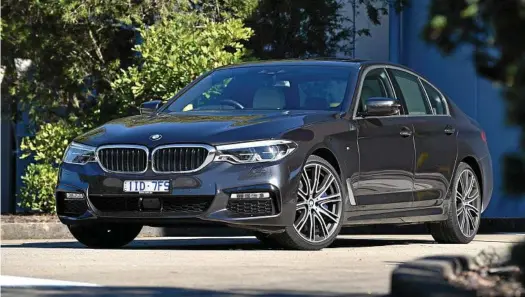  ?? PHOTOS: IAIN CURRY ?? GRACE AND PACE: The BMW 540i costs from $136,900 before on-road costs, while our test version (pictured) was $167,473 before charges thanks to some generous selections on the options list. Despite the price, it would be hard to wish for much more in an...