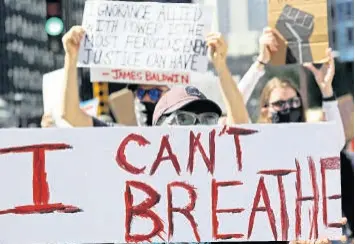  ?? AP ?? Demonstrat­ors attend a march for justice in honour of George Floyd on Saturday, June 13, in Chicago. Floyd died after being restrained by Minneapoli­s police officers on May 25.