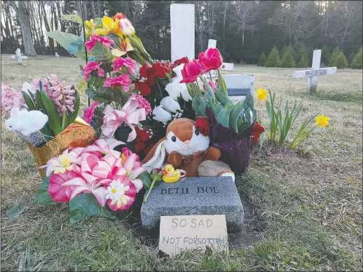  ?? (Kelly Monitz/Standard-Speaker via AP) ?? Flowers and a child’s toy also adorn the grave of Evelyn and Emily Grace Colon. Colon, who was known for decades in Northeast Pennsylvan­ia as Beth Doe, was brutally murdered and dumped off an Interstate 80 bridge in East Side borough in December 1976.