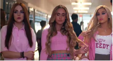  ??  ?? Grande references ‘Mean Girls’ as she assumes the role of Regina George (right). — You Tube