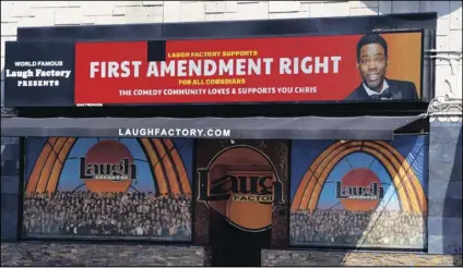  ?? CHRIS PIZZELLO/AP ?? A message expressing support for comedian Chris Rock is displayed on the digital marquee of the Laugh Factory comedy club Wednesday in Los Angeles.