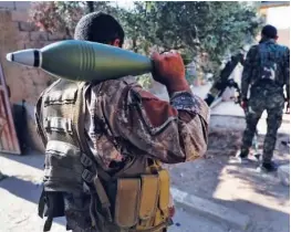  ?? File photo/associated Press ?? In this July 27, 2017 photo, Us-backed Syrian Democratic Forces fighters prepare to fire a mortar shell, at one of the front lines in Raqqa, northeast Syria.