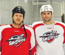  ??  ?? Mike Weber, right, seen here with Steve Ott, is staying on as an assistant coach with the Spitfires after signing a three-year contract on Wednesday.