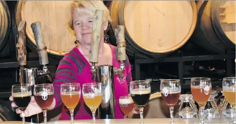  ?? PHOTOS: BARBARA TAYLOR ?? Frezi Bouckaert pours a variety of craft beers for visitors to sample at Purpose Brewing and Cellars in Fort Collins, the craft beer capital of Colorado.