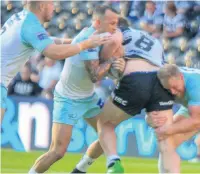  ?? Simon Hall ?? Vikings players put in a great effort to stop Hull FC prop-forward Scott Taylor.