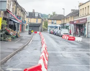  ??  ?? The row of barriers in Moreland Road, designed to help social distancing