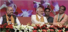  ?? — PTI ?? Prime Minister Narendra Modi, flanked by BJP president Amit Shah and Madhya Pradesh chief minister Shivraj Singh Chouhan, during the BJP’s ‘ Karyakarta Mahakumbh’ in Bhopal on Tuesday.