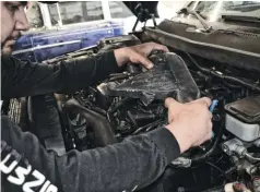  ??  ?? tbrown’s Diesel technician Gustavo “Goose” Quezada started by removing the engine cover on our stock, highmileag­e engine. There are a few things that need to be taken off in order to gain access to all 26 head bolts. The intake horn was the first item to be removed.