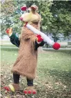  ?? CHRIS YOUNG/ THE CANADIAN PRESS ?? Tokaroo marked the first day of legalizati­on of cannabis across Canada in a Toronto park on Oct. 17. Mascot maker Mark Scott says he will not buckle to legal threats over his pothead parody of children’s TV character Polkaroo.