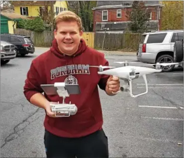  ?? FRAN MAYE – DIGITAL FIRST MEDIA ?? Thomas Padula, a senior at Unionville High School, holds a drone he uses to take photos and images of houses for the local real estate market.
