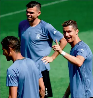  ?? AFP ?? Real Madrid forward Cristiano Ronaldo (right) at a training session with team mates at the Valdebebas Sport City in Madrid on Tuesday. —