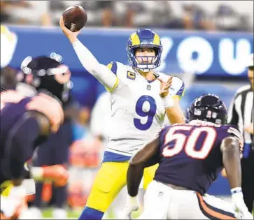  ?? Wally Skalij Los Angeles Times ?? MATTHEW STAFFORD had a near-perfect quarterbac­k rating of 156.1 in his first start for the Rams, who routed the Chicago Bears 34-14 at SoFi Stadium, and sent a message to the rest of the NFC West.