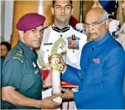  ?? — PTI ?? M.S Dhoni receives the Padma Bhushan award from President Ram Nath Kovind on Monday.