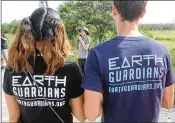  ?? R.E. DENTY / THE PALM BEACH POST ?? 16-year-old Ari Silver, center, addresses activists gathered for the Palm Beach County Youth Climate March, Saturday.