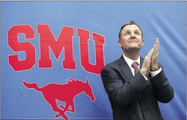  ?? LM OTERO/ASSOCIATED PRESS FILES ?? New Southern Methodist University head football coach Chad Morris claps after being introduced last year in Dallas. He inherits a team that was 1-11 last year, so he has his work cut out for him. If the Mustangs get stampeded this year, he won’t be...
