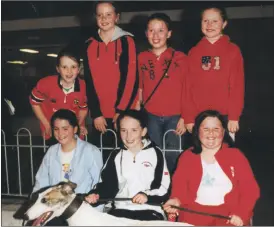  ?? ?? Conna children Rachel Murphy, Ciara Clancy, Aoife Neville, Nicola O’Donoghue, Emma Neville, Fiona Cotter and Finola Neville, supporting St Catherine’s GAA at their benefit night at Cork Dog Track in 2002.