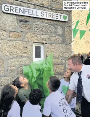  ?? IMAGES: CORNWALL HUGS GRENFELL ?? At the unveiling of the Grenfell Street sign in Mousehole, Cornwall