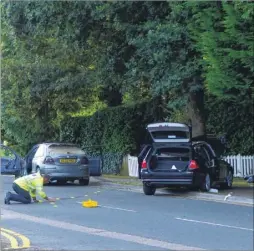  ?? Picture: Andy Clark ?? Police examining the scene of the accident