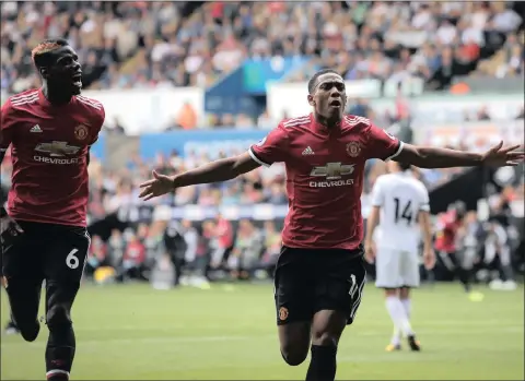  ??  ?? FRENCH CONNECTION: Manchester United’s Anthony Martial, right, scoring against Swansea with teammate Paul Pogba, left, during last Saturday’s Premier League match at the Liberty Stadium in Swansea.