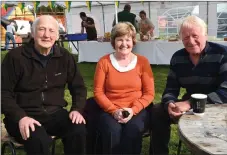  ??  ?? Fr Paddy O’Donoghue, Killarney with Margaret and Denis Galvin from Beaufort who celebrated their 50th wedding anniversar­y last weekend, enjoying the Threshing Cancer day in Beaufort.